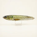 Largemouth bass pattern JigSkinz lure skin on a stickbait, displayed on clear stand against dark background