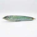 Blueback herring pattern JigSkinz lure skin on a topwater stickbait, side view on dark countertop