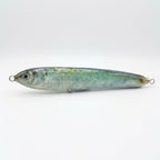 Blueback herring pattern JigSkinz lure skin on a topwater stickbait, side view on dark countertop