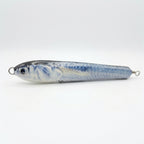 Ballyhoo pattern JigSkinz lure skin on a saltwater pencil popper, side view on dark background