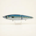 Mackerel pattern JigSkinz lure skin on a jointed swimbait, held on wooden table
