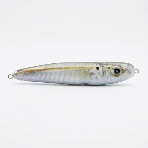 Cigar minnow pattern JigSkinz lure skin on a saltwater stickbait, side view on dark surface