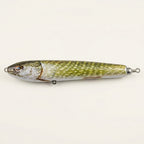 Northern pike pattern JigSkinz lure skin on a stickbait, side view on stone pavers in sunlight