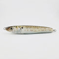 Menhaden bunker pattern JigSkinz lure skin on a saltwater stickbait, side view on dark background