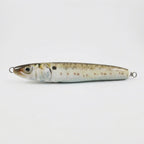 Menhaden bunker pattern JigSkinz lure skin on a saltwater stickbait, side view on dark background