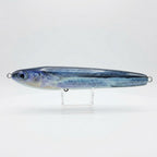 Flying fish pattern JigSkinz lure skin on a saltwater stickbait, on clear stand outdoors